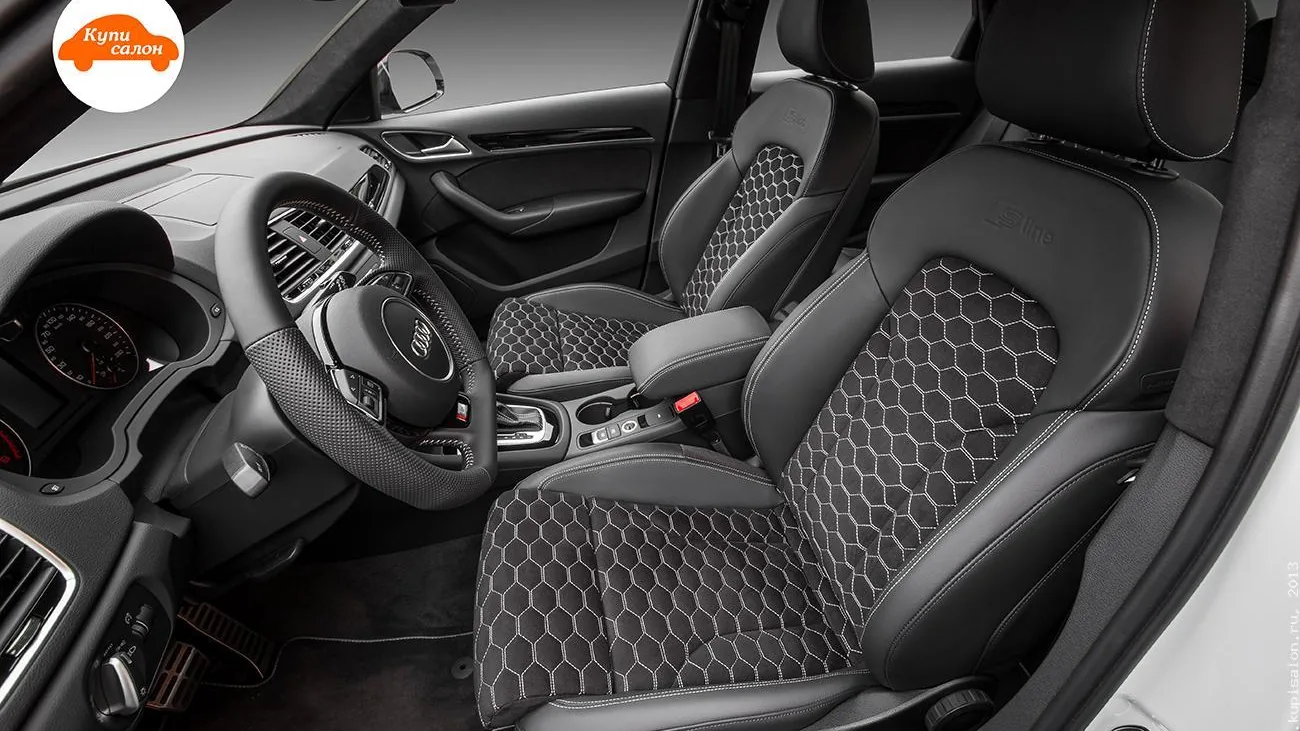 Перетяжка салона Audi Q3, черная кожа с сотовой перфорацией и белой строчкой, перетяжка руля.